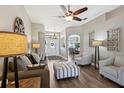Stylish living room with hardwood floors, neutral decor, and ample seating at 369 Belhaven Falls Dr, Ocoee, FL 34761