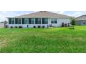 Spacious backyard with lush green grass and privacy at 530 Sanctuary Blvd, Winter Haven, FL 33881