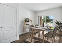 Dining area with table and chairs, adjacent to sliding glass doors at 5626 Paddock Fence Ln, Apopka, FL 32712
