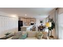 Open floor plan with modern kitchen and comfortable living space at 649 E Howry Ave, Deland, FL 32724