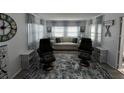 Cozy living room with large windows, comfortable seating, and stylish decor creating a welcoming atmosphere at 662 Sinclair Cir, Tavares, FL 32778