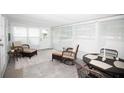 Bright sunroom with tile floor and comfortable seating area perfect for relaxing at 662 Sinclair Cir, Tavares, FL 32778