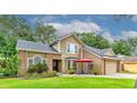Charming two-story home features a well-manicured lawn, front patio with seating, and inviting curb appeal at 848 Bucksaw Pl, Longwood, FL 32750