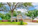 Traditional two-story home with an attached garage, manicured lawn, and comfortable front patio area for relaxing at 848 Bucksaw Pl, Longwood, FL 32750