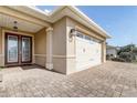 Attractive home featuring an elegant front door and a three-car garage at 9058 Sw 89Th Loop, Ocala, FL 34481