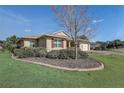 Charming single-story home with a well-manicured lawn and mature landscaping at 9058 Sw 89Th Loop, Ocala, FL 34481