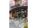 Uptown Place apartment building with glass entryway and modern lighting at 911 N Orange Ave # 448, Orlando, FL 32801