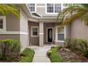 Inviting front entrance with a detailed front door and well-manicured landscaping at 980 Crestwood Commons Ave, Ocoee, FL 34761