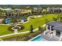 Aerial view of community park, showcasing playground and recreational areas near luxury homes at 1015 Jack Nicklaus Ct, Kissimmee, FL 34747