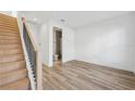 Bright bedroom with wood floors, a closet, and an en-suite bathroom at 2225 Valentine Aly, Orlando, FL 32804