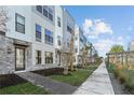 Landscaped walkway leading to modern townhouses at 2225 Valentine Aly, Orlando, FL 32804