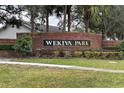 Brick entrance sign for the WeKiva Park community at 324 Morning Creek Cir, Apopka, FL 32712