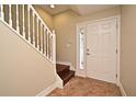 Interior entryway with staircase and tile flooring at 4220 Messina Dr, Lake Mary, FL 32746