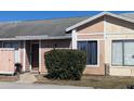 The house features a sidewalk leading to the front door, accompanied by a small, green bush at 4709 Almond Willow Dr, Orlando, FL 32808