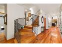 Elegant wooden staircase with wrought iron railings at 5800 N Dean Rd, Orlando, FL 32817