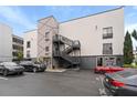 Commercial property featuring a unique exterior design, well-lit parking, and an easy access staircase at 62 W Colonial Dr # 302, Orlando, FL 32801