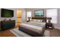 Main bedroom with a king-size bed and en-suite bathroom at 14424 Quail Trail Ct, Orlando, FL 32837