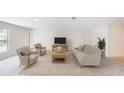 Spacious living room featuring a neutral color palette and comfortable seating at 1523 5Th Ave, Deland, FL 32724