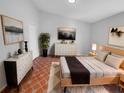 Spacious bedroom with dresser and a large bed at 203 San Gabriel St, Winter Springs, FL 32708