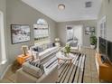 Bright living room with comfy seating and tiled floors at 203 San Gabriel St, Winter Springs, FL 32708