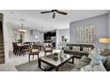 Spacious living room with comfortable seating and large artwork at 3097 Pequod Pl, Kissimmee, FL 34746