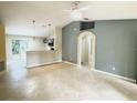 Open living room with high ceilings and a view into the kitchen at 333 E Church St, Deland, FL 32724