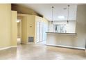 Open living room with high ceilings and a view into the kitchen at 333 E Church St, Deland, FL 32724