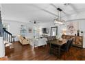 Open living and dining area with hardwood floors and modern furniture at 4713 Anson Ln, Orlando, FL 32814