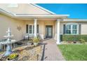 Inviting front entrance featuring a beautiful fountain and a cozy seating area at 1012 Everest St, Clermont, FL 34711