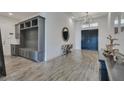Bright and spacious foyer with built-in bench and storage at 13265 Alderley Dr, Orlando, FL 32832