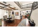 Grand foyer featuring wood floors, high ceilings, wood beams, iron staircase, and open floor plan at 13596 Gorgona Isle Dr, Windermere, FL 34786