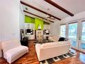Living room with hardwood floors, fireplace, and built-in shelves at 2047 Friar Tuck Ln, Orange City, FL 32763