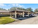 Community carport providing covered parking spaces for residents and visitors, enhancing convenience at 2214 Se Sawgrass Ct, Winter Haven, FL 33884