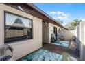 Exterior view showcasing the patio area with seating, enhancing outdoor living at 2214 Se Sawgrass Ct, Winter Haven, FL 33884