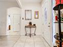 Inviting entryway featuring tile flooring, console table, and decorative accents at 2218 W Gore St, Orlando, FL 32805