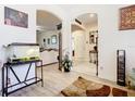 Open living area with tile flooring, arched doorways, and a view to the Entryway at 2218 W Gore St, Orlando, FL 32805