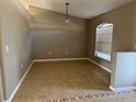 Empty dining room featuring neutral walls, tile floors, and a window with blinds at 2639 Janet Ct, Deltona, FL 32738