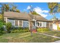 View of the exterior of the house, landscaping, windows, and architectural details at 404 W 19Th St, Sanford, FL 32771