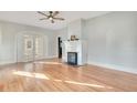 Bright living room with hardwood floors, fireplace and charming arched doorway at 404 W 19Th St, Sanford, FL 32771