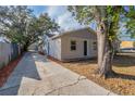 Charming home with a long driveway leading to a detached garage and tidy landscaping at 424 S Observatory Dr, Orlando, FL 32835