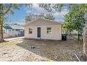 Cozy single-story home with a simple facade and small windows, surrounded by trees at 424 S Observatory Dr, Orlando, FL 32835