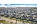 Expansive aerial view of a residential community with well-maintained homes and streets at 651 Tortugas St, Haines City, FL 33844