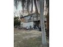 Unfinished wooden house with a small deck at 310 Lake Ave, Dundee, FL 33838