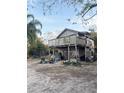 Unfinished wooden house with a large deck at 310 Lake Ave, Dundee, FL 33838