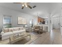 Bright open-concept living area with neutral decor and seamless flow to dining and kitchen at 10421 Manderley Way # 268, Orlando, FL 32829