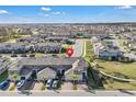 Wide aerial view of a community featuring modern townhomes and manicured lawns at 12043 Holystone St, Winter Garden, FL 34787