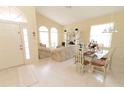 Bright, neutral living room with arched windows, high ceilings, tile floors, and comfortable seating at 1809 Wedgewood Way, Kissimmee, FL 34746