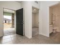 Bright foyer featuring tile flooring, and views of a bedroom, bathroom, and the front door at 1893 Sierra Sun Way, Clermont, FL 34715