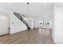 Bright and spacious living room with hardwood floors and modern staircase at 2221 Valentine Aly, Orlando, FL 32804