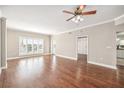 Open living area with wood floors, bright shutters and open floor plan at 2305 Edgewater Dr # 1403, Orlando, FL 32804